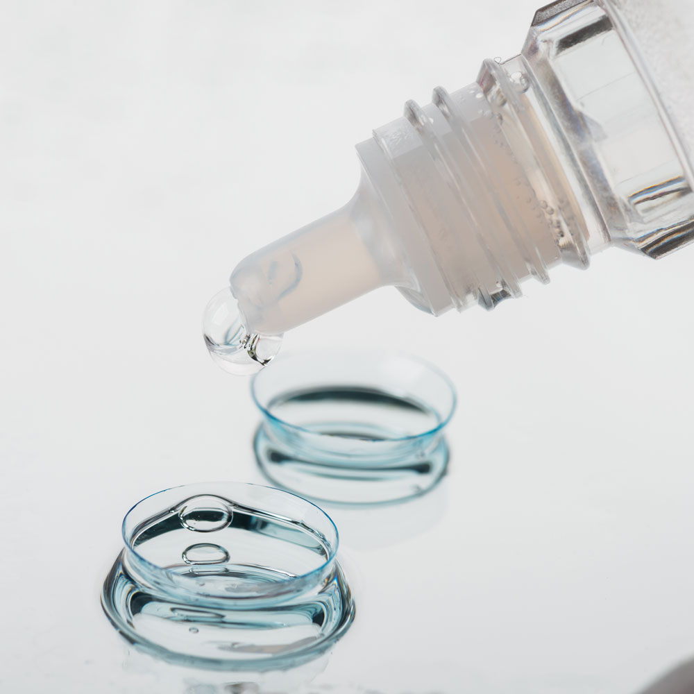 Contact lens solution being put onto contact lenses Contact lens solution being put onto contact lenses