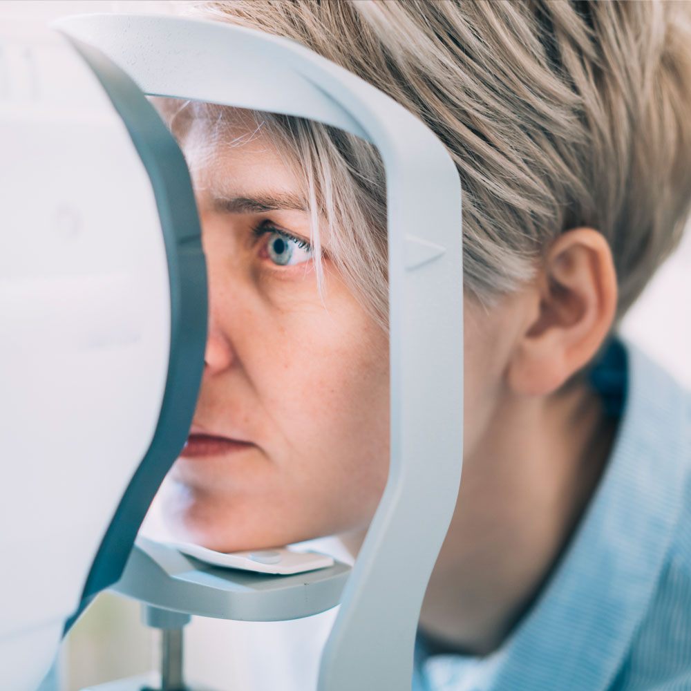 Woman undergoing an OCT scan Woman undergoing an OCT scan