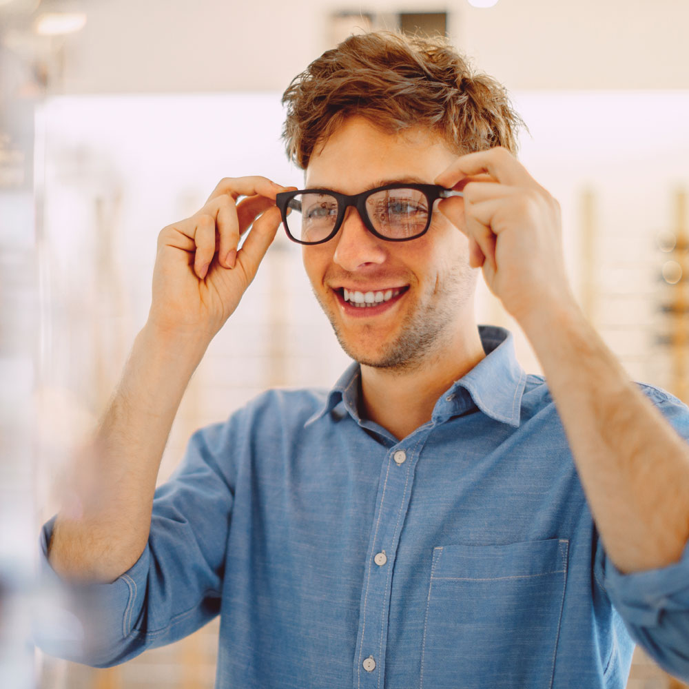 Man trying on a frame in a practice Man trying on a frame in a practice