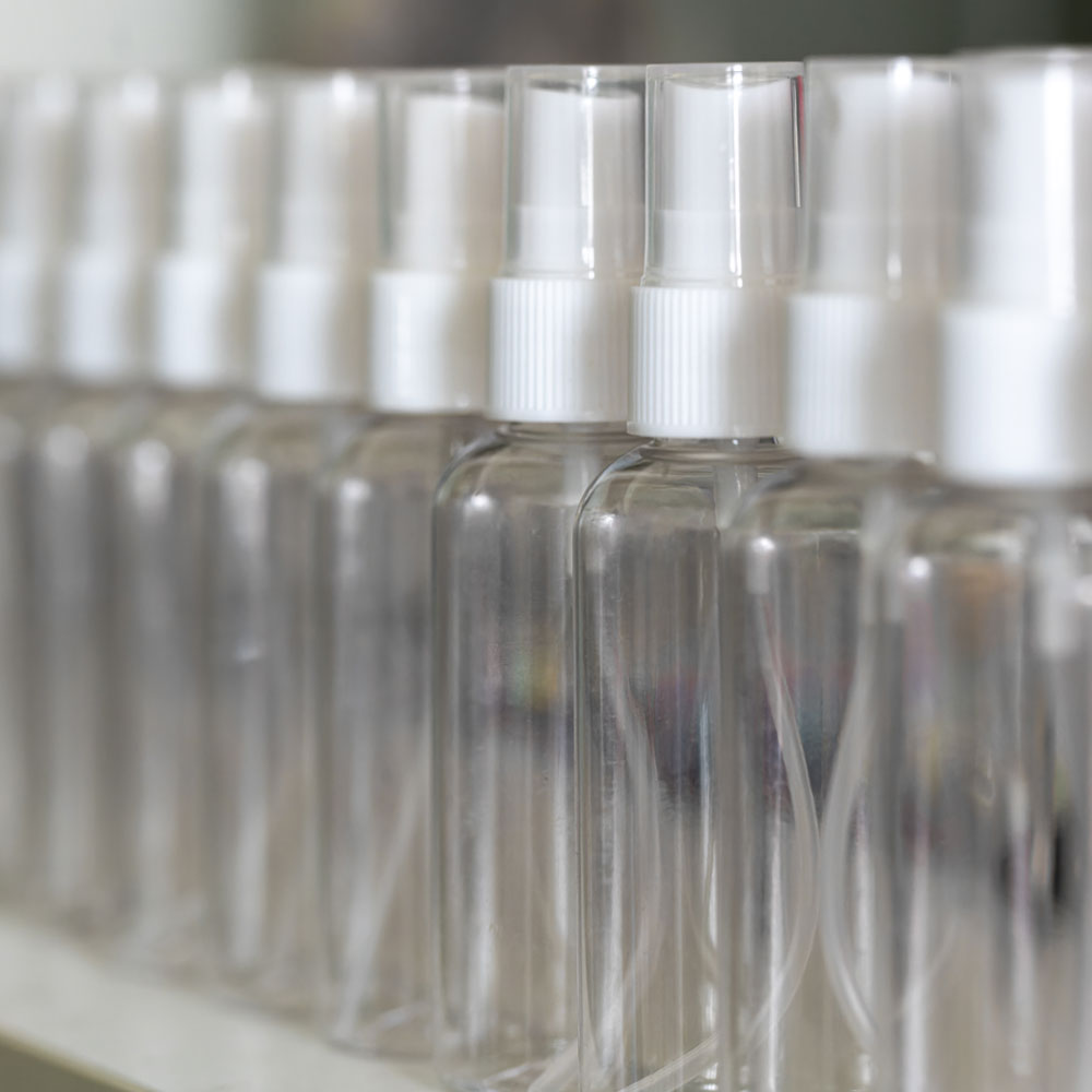 Empty lens-spray bottles in a row Empty lens-spray bottles in a row